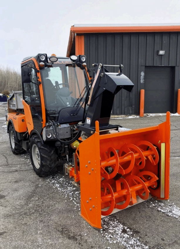 Karcher double auger box blower attachment for municipal equipment in use