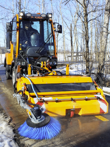 Karcher hydraulic sweeper with pickup attachment for municipal equipment in use
