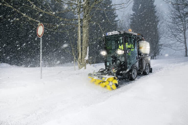 Karcher front roller brush attachment for municipal equipment in use
