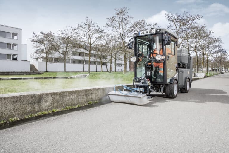 Karcher hot water weed killer attachment for municipal sweepers in use