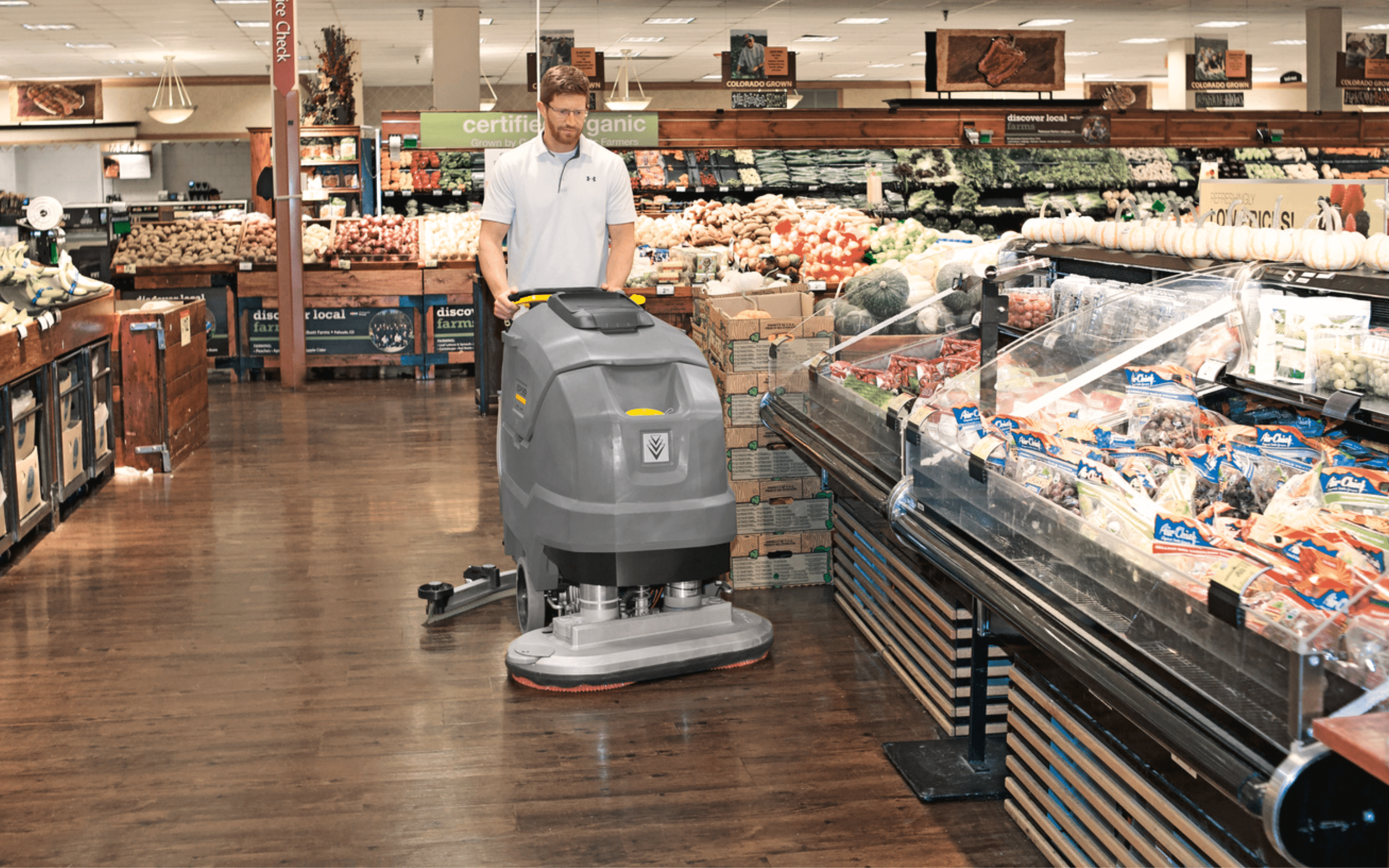 commercial floor scrubbing machine in a grocery store